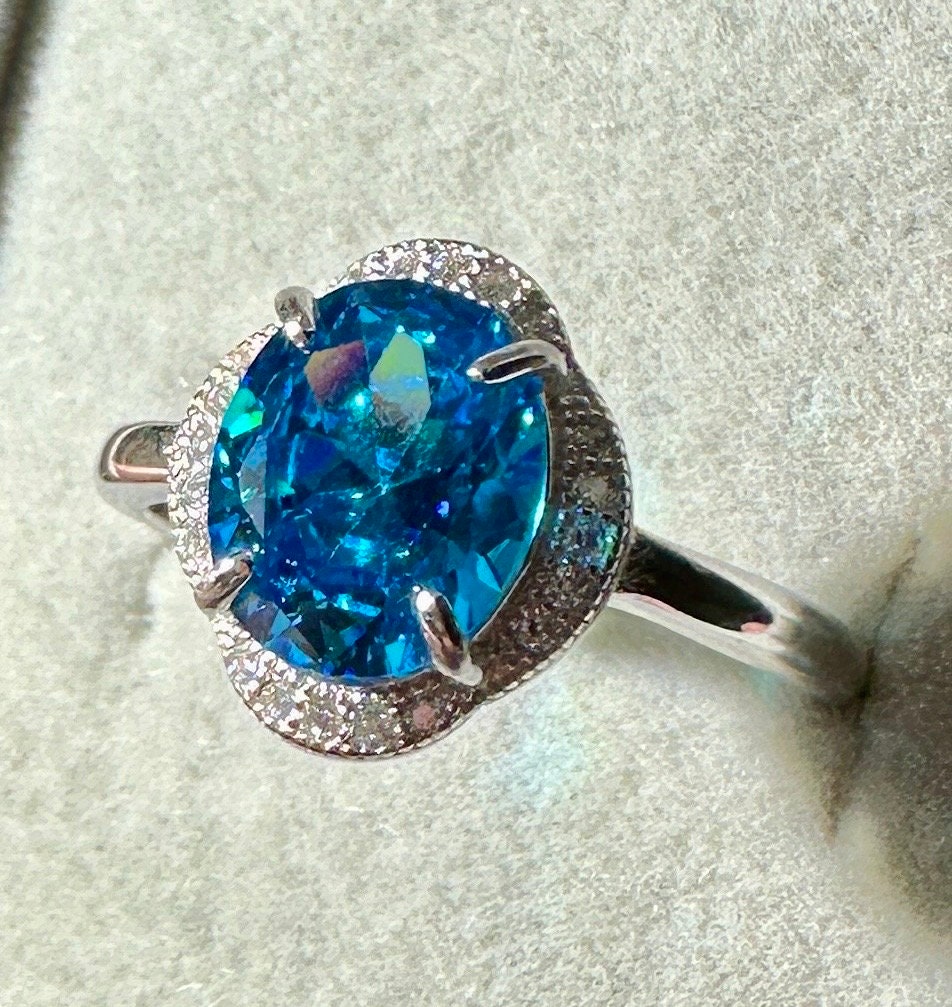 London Blue Topaz Oval Shaped Sterling Silver Adjustable Ring with CZ Accents - December Birthstone