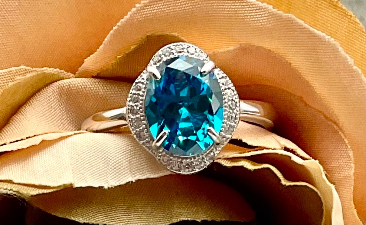 London Blue Topaz Oval Shaped Sterling Silver Adjustable Ring with CZ Accents - December Birthstone